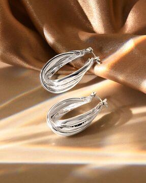 silver-toned hoops earrings