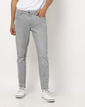 skinny fit mid-rise lightly washed jeans