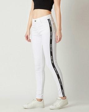 skinny jeans with typographic taping