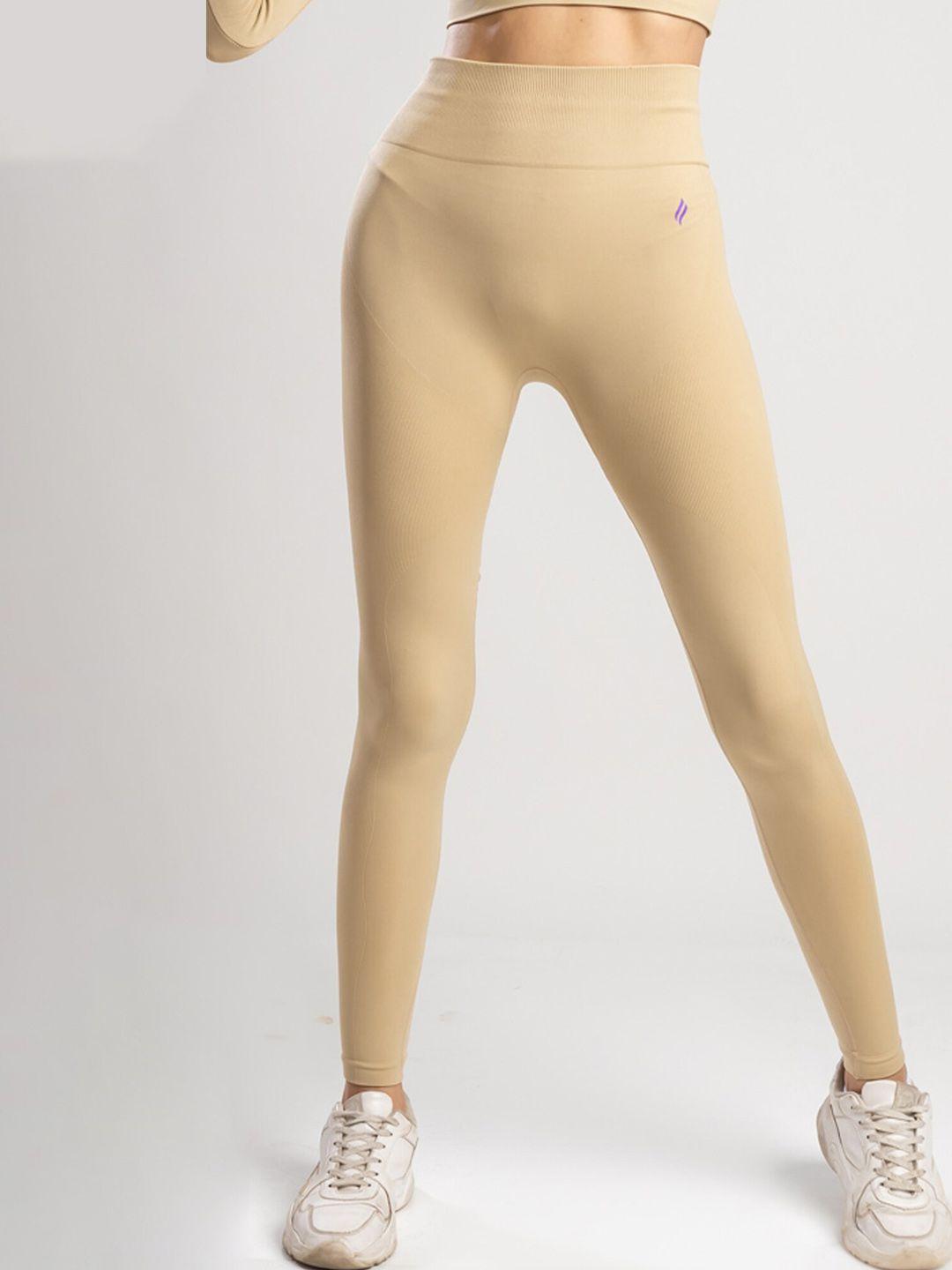 sknz women beige colored solid antimicrobial tights