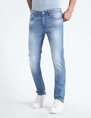 slash slim tapered distressed jeans
