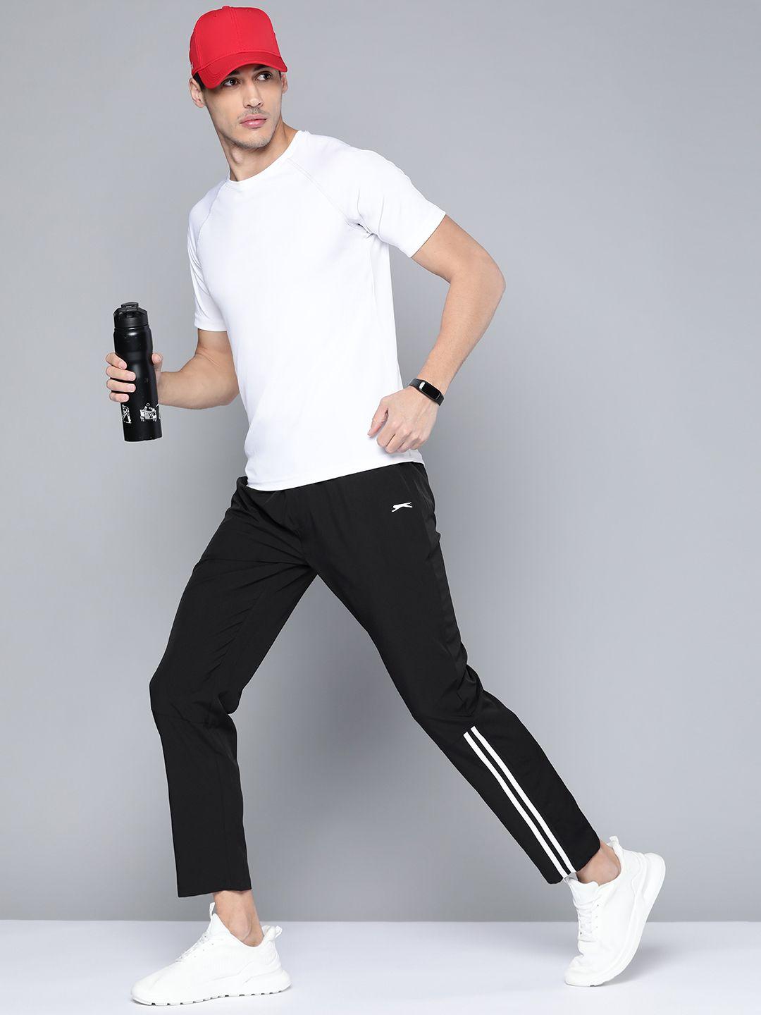 slazenger men black solid track pants with stripe detail