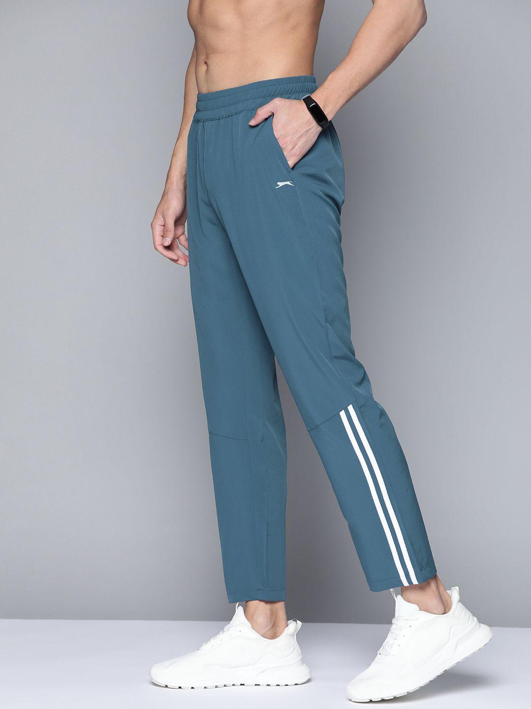 slazenger men teal blue solid track pants with stripe detail