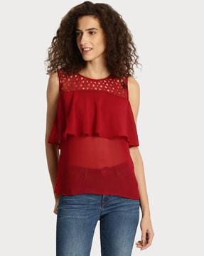 sleeveless top with laser cutouts