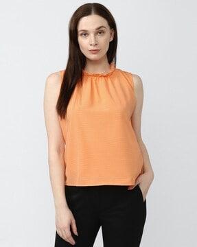 sleeveless top with ruffled neckline