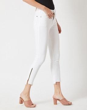 slim fit cropped jeans with frayed hems