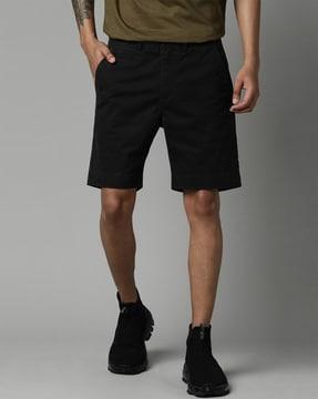 slim fit flat-front shorts with insert pockets