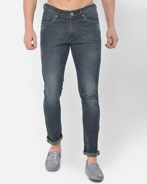 slim fit light-distressed jeans