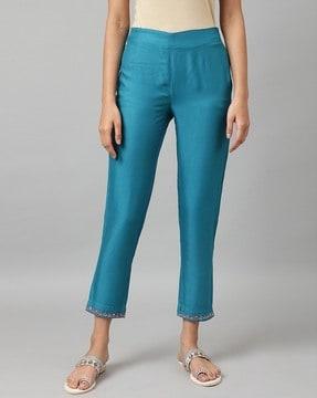 slim fit pants with placement embroidery