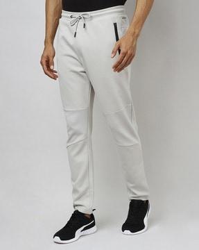 slim fit track pants with drawstring fastening