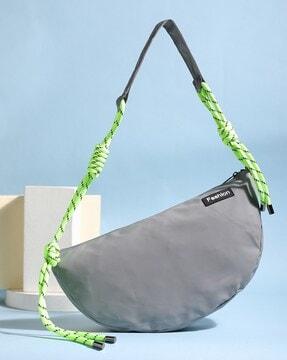 sling bag with external pocket