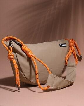 sling bag with external pocket