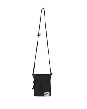 sling bag with external zip pocket