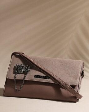 sling bag with stone embellishments