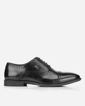 slip-on formal shoes with broguing