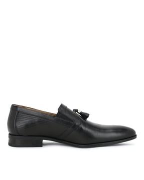 slip-on shoes with tassels