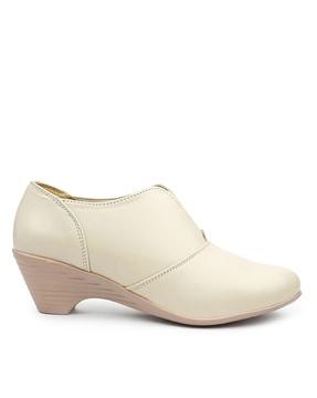 slip-on booties with wedge heels