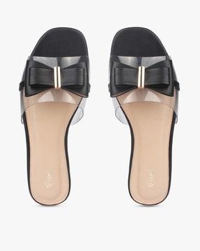 slip-on flat sandals with bow accent