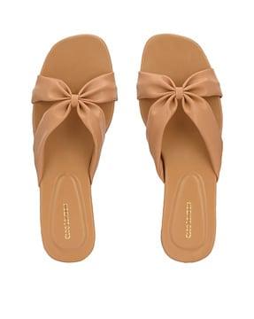 slip-on flat sandals with bow accent