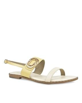 slip-on flat sandals with buckle closure