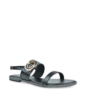 slip-on flat sandals with buckle closure