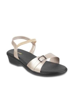 slip-on flat sandals with metal accent