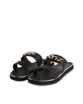 slip-on flat sandals with metal accent