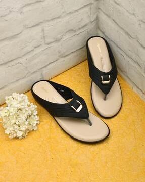 slip-on flat sandals with metal accent