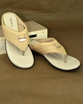 slip-on flat sandals with metal accent