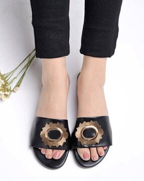 slip-on flat sandals with metal applique