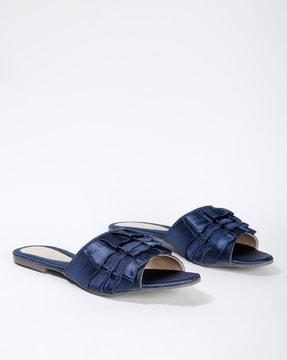 slip-on flat sandals with ruffles