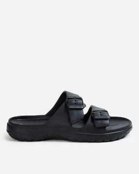 slip-on flip flops with buckle fastening strap