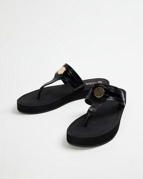 slip-on sandals with metal accent