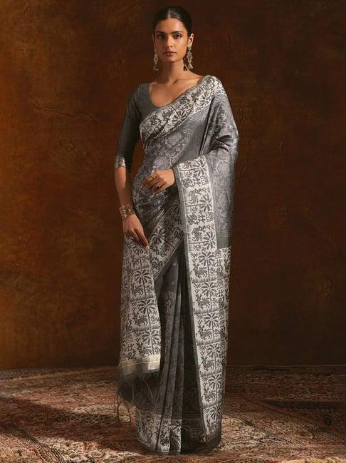 soch charcoal tussar floral pattern woven saree with tasselled border