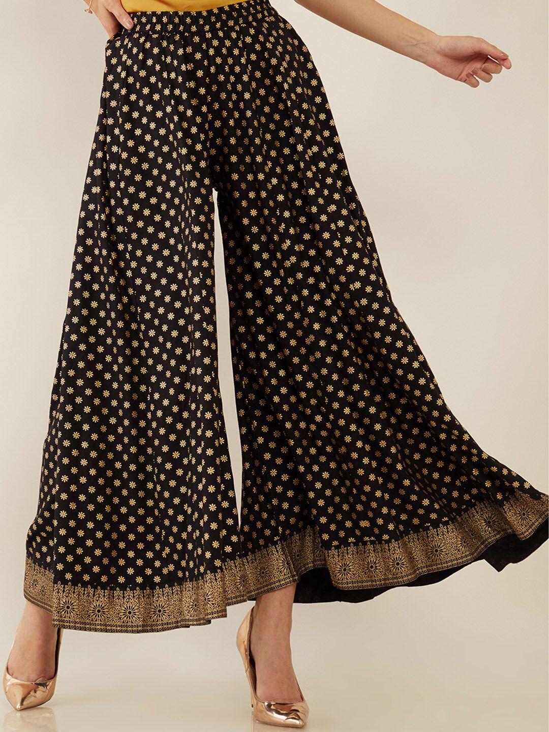soch women black & gold-toned floral printed flared ethnic palazzos