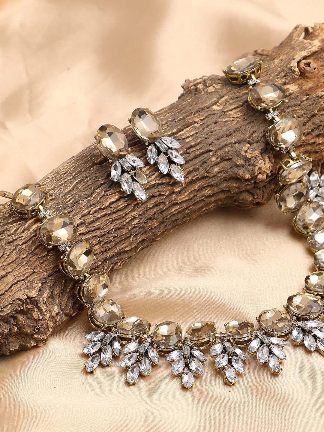 sohi gold-plated white & cream stone-studded jewellery set