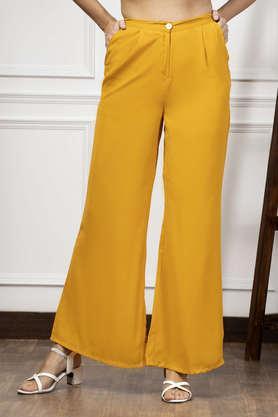 solid flared fit polyester women's casual wear trouser - yellow