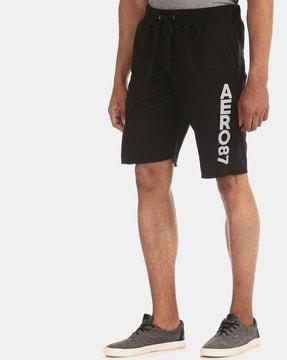 solid mid-rise shorts with elasticated drawstring waist