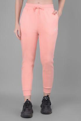 solid slim fit blended fabric women's casual wear track pants - pink
