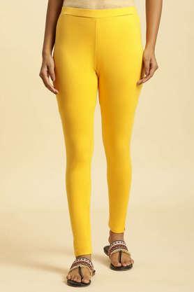 solid ankle length blended fabric women's legging - mustard