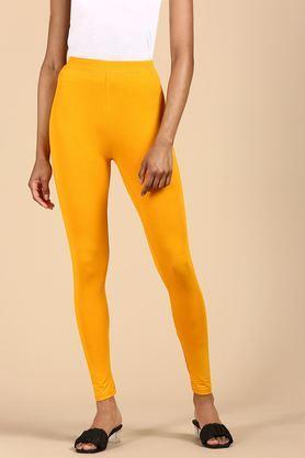 solid ankle length blended fabric women's leggings - yellow