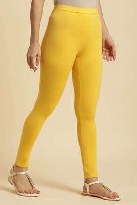 solid ankle length cotton blend women's churidar - yellow