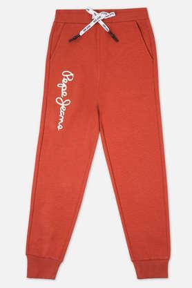 solid blended fabric regular fit boys track pants - orange