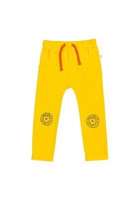 solid cotton regular fit boys track pants - mustard
