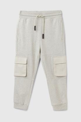 solid cotton regular fit boys track pants - off white