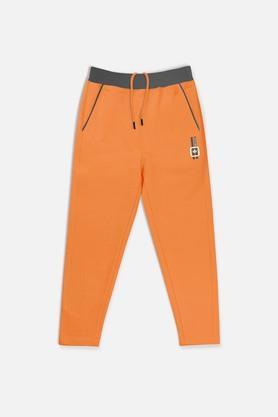 solid cotton regular fit boys track pants - orange