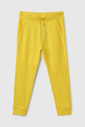 solid cotton regular fit boys track pants - yellow
