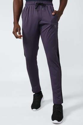 solid polyester regular fit men's track pants - purple