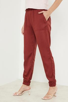 solid regular fit blended fabric women's casual wear pant - rust