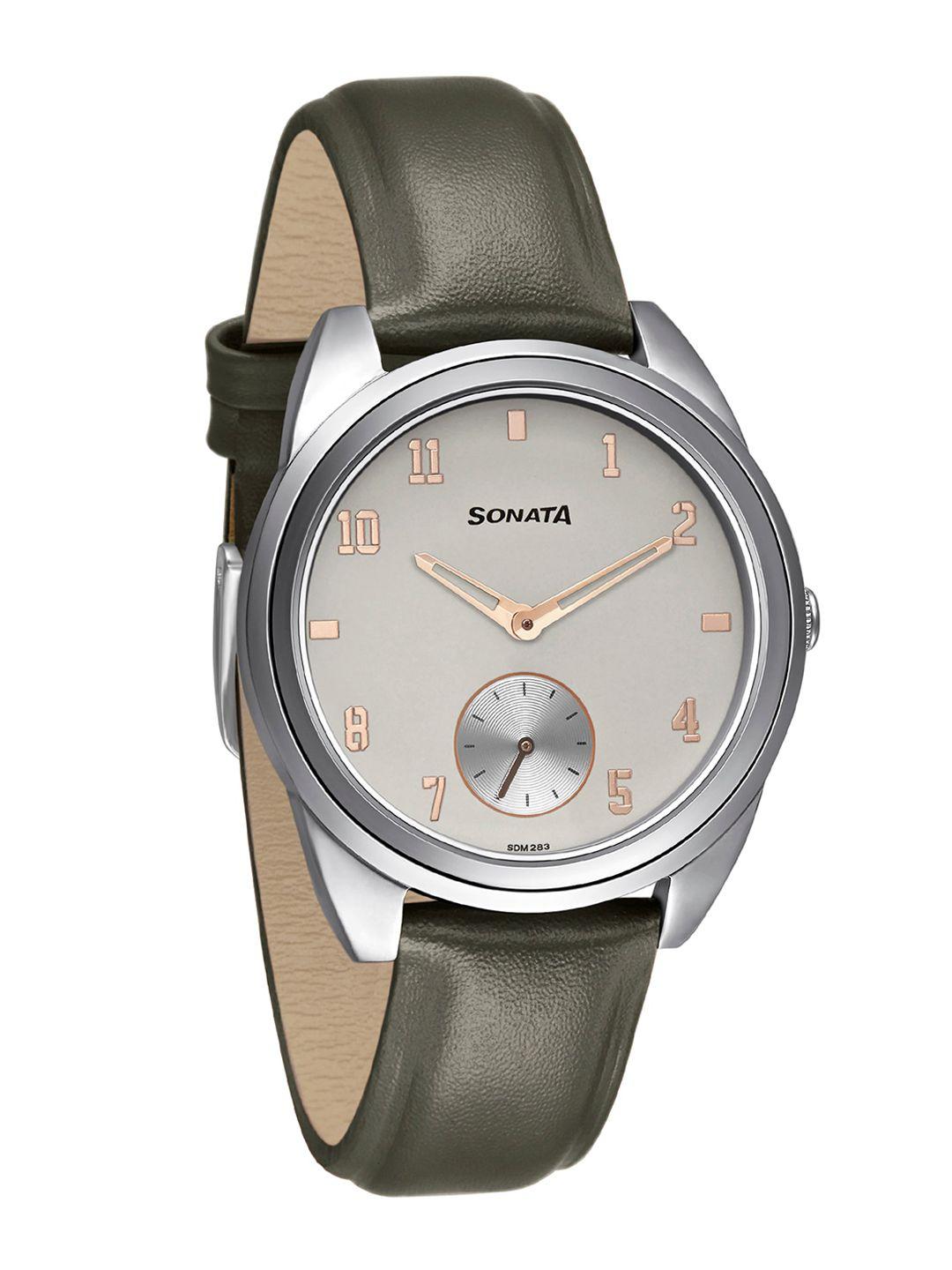 sonata women grey brass dial & green leather straps analogue watch 8182sl02